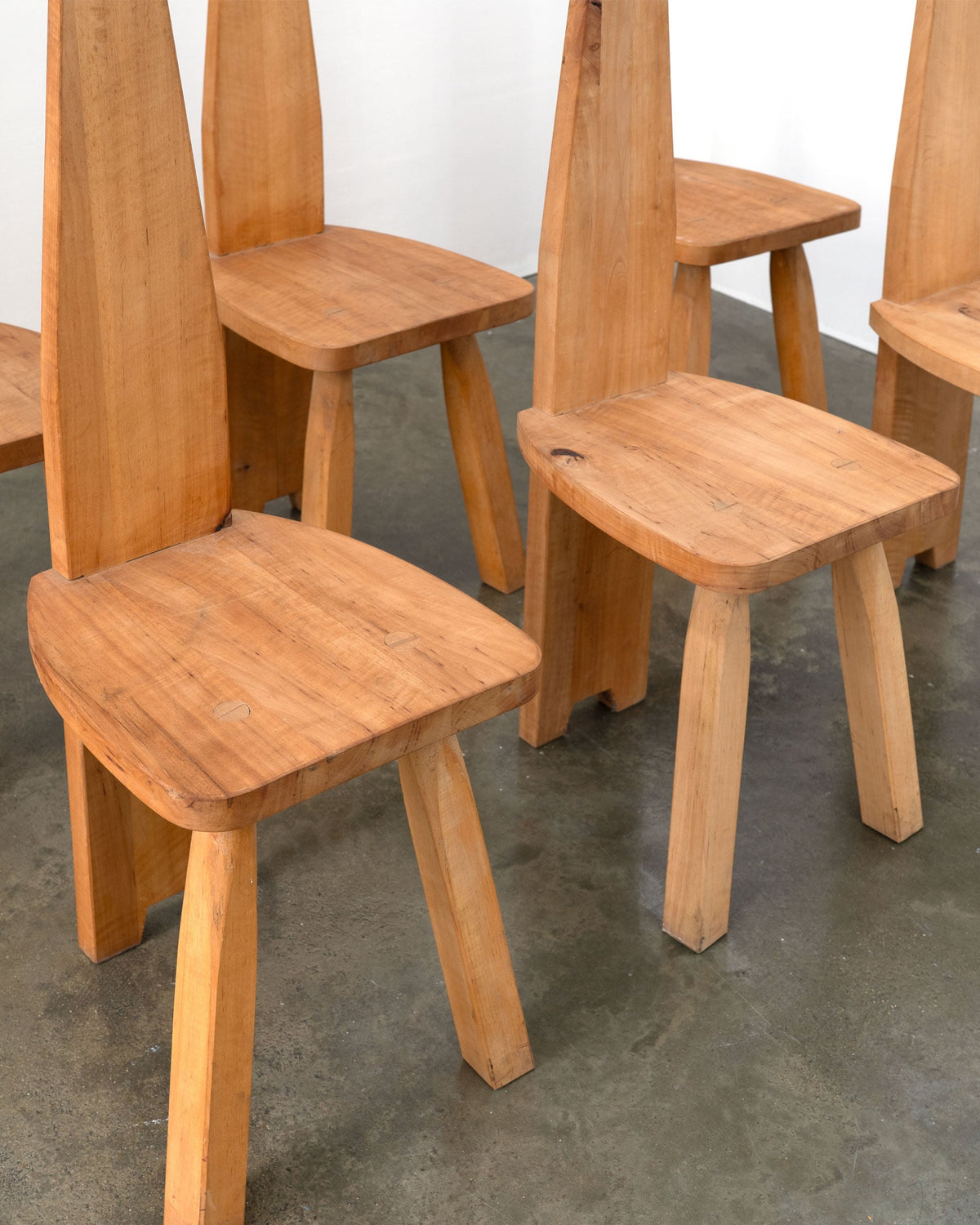 Set of six brutalist solid wood high back chairs with sculptural construction