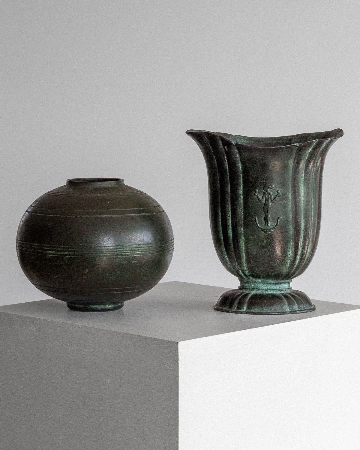 Dark green cast iron Art Deco vases with patina finish display