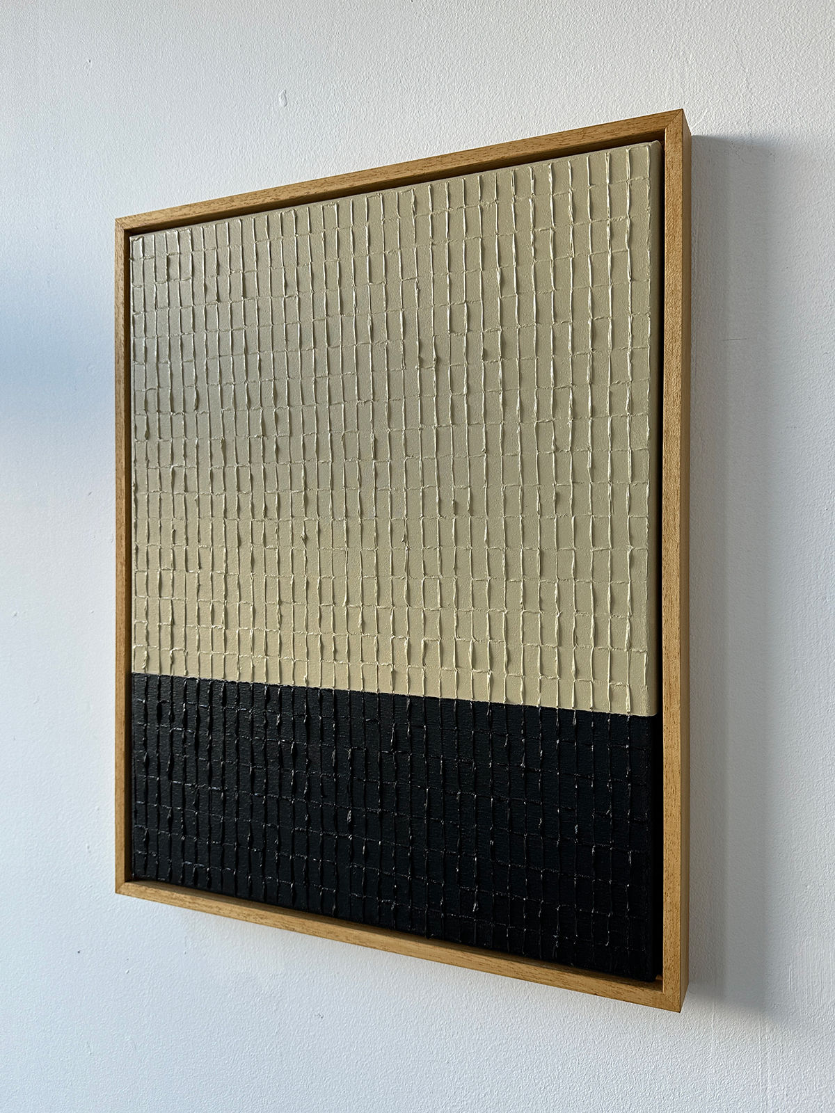 Textured canvas painting detail showing buff and black color blocks