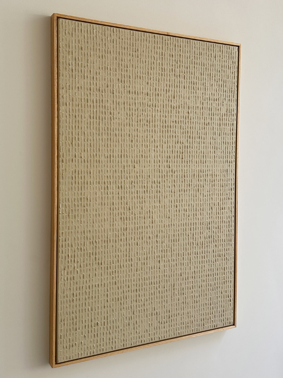 Textured beige abstract painting with geometric pattern by Roi Elmaliah