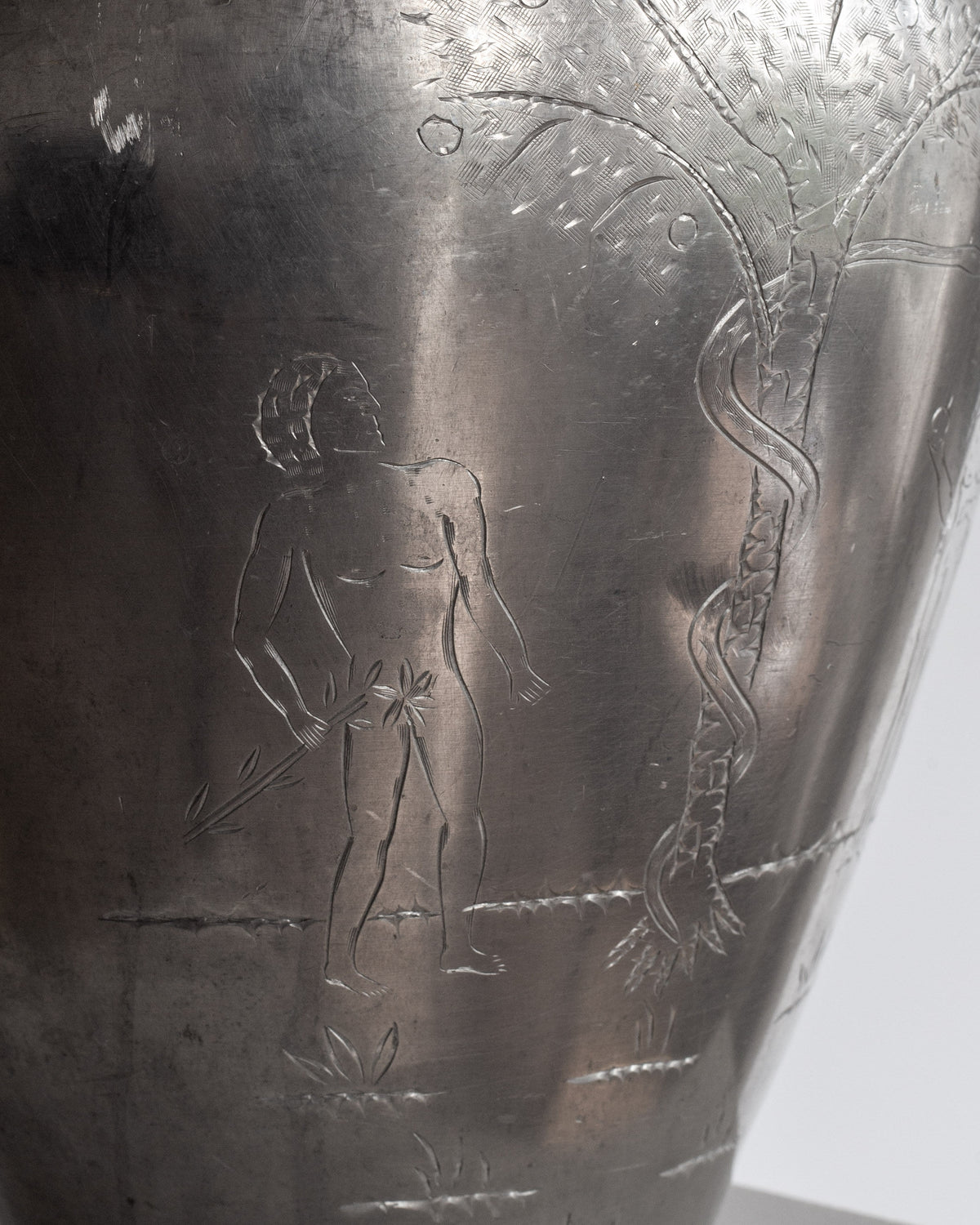 Detail of Adam and Eve engraving on Swedish pewter amphora 1930s