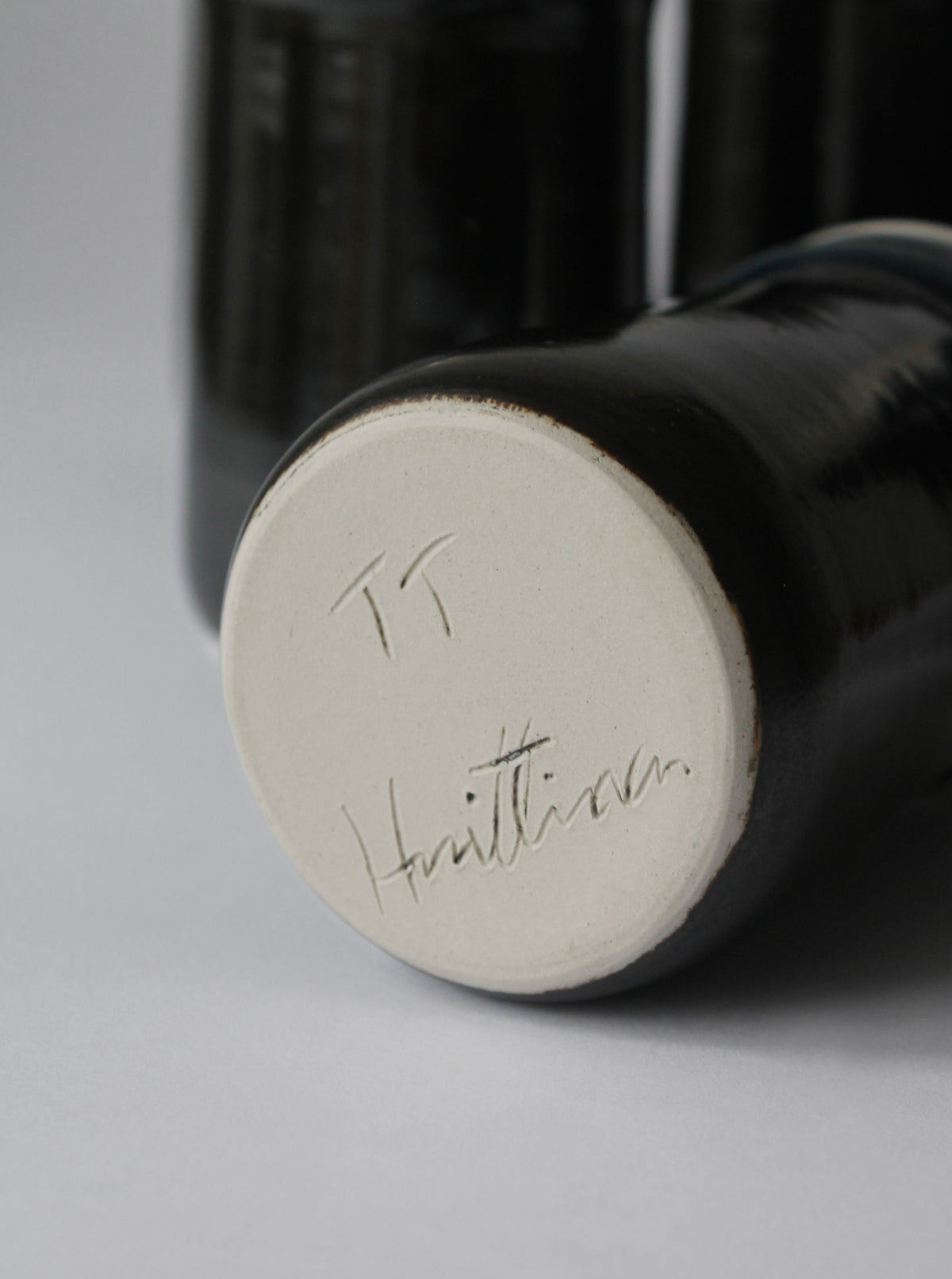 Bottom signature detail of Finnish ceramic drinking tumbler