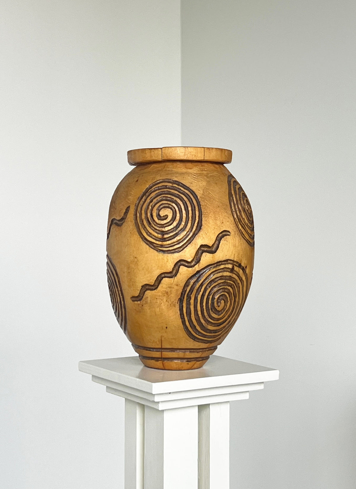 Hand carved wooden vase with spiral motifs by Porter Studio