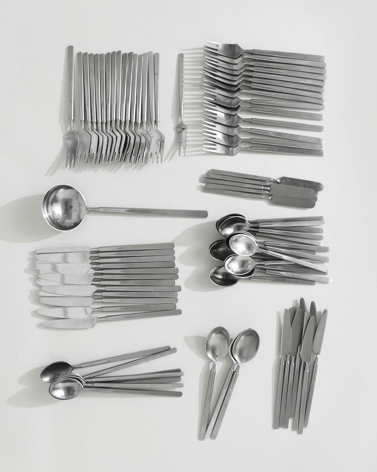 Modern stainless steel flatware set with geometric handles by Erik Herløw