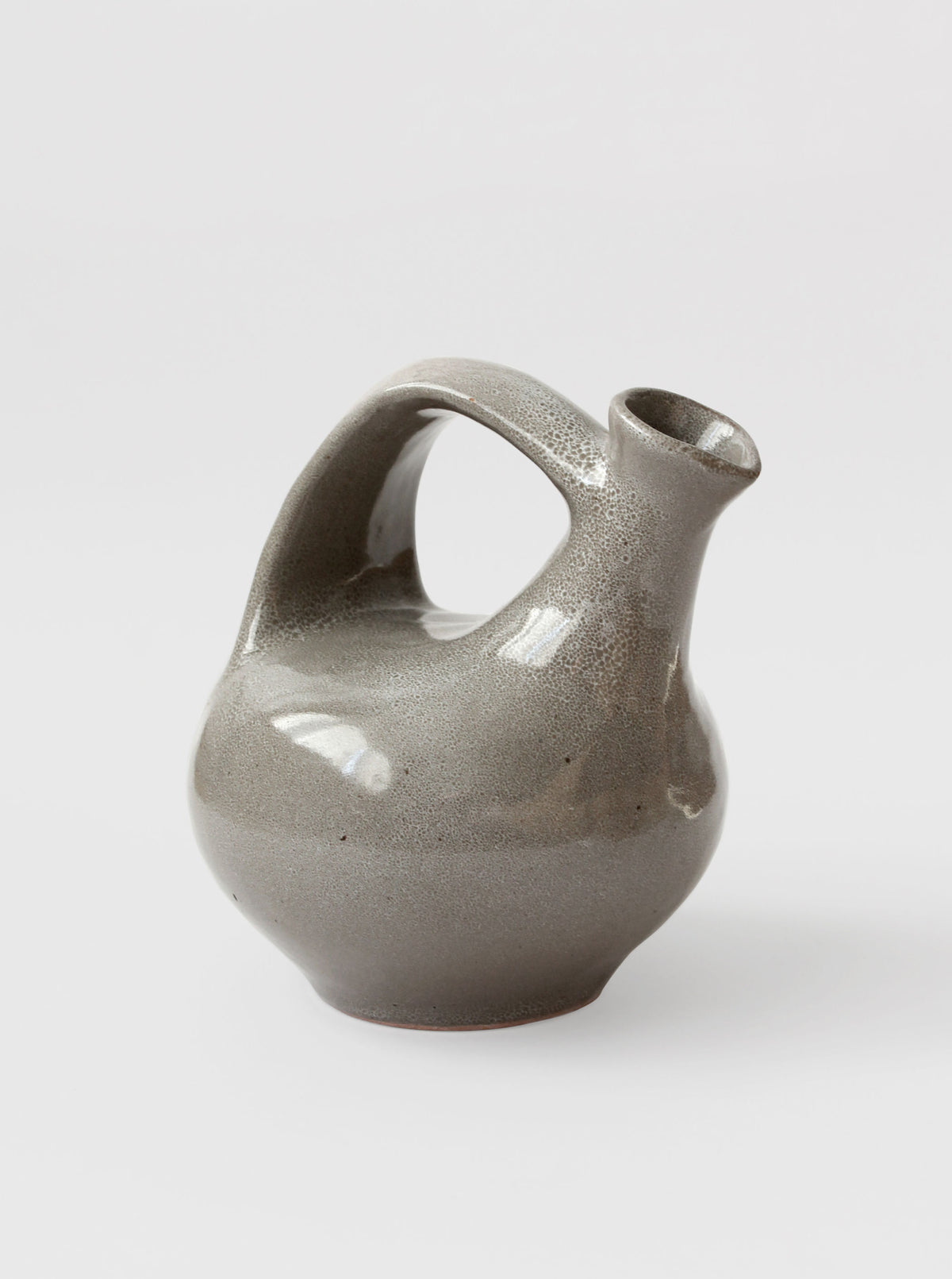 Grey ceramic mid-century jug with curved handle and spout detail