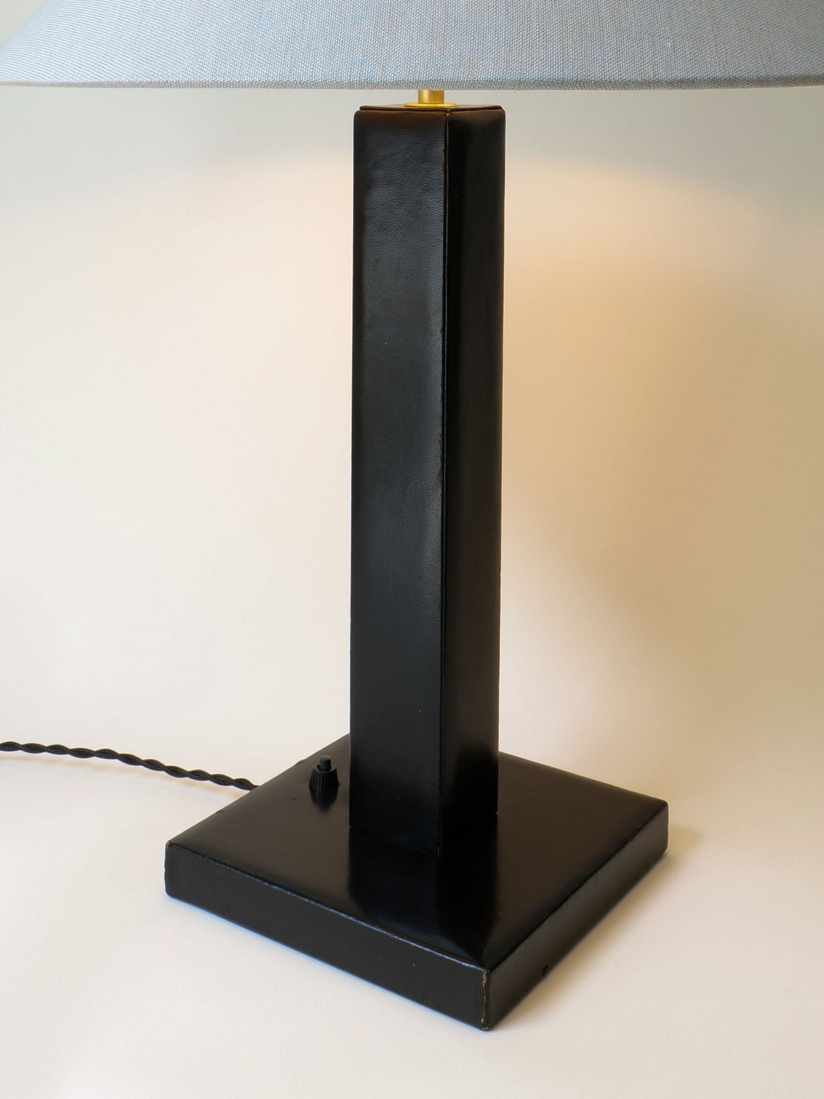 Black leather table lamp base with vertical column design by Adnet 1950s