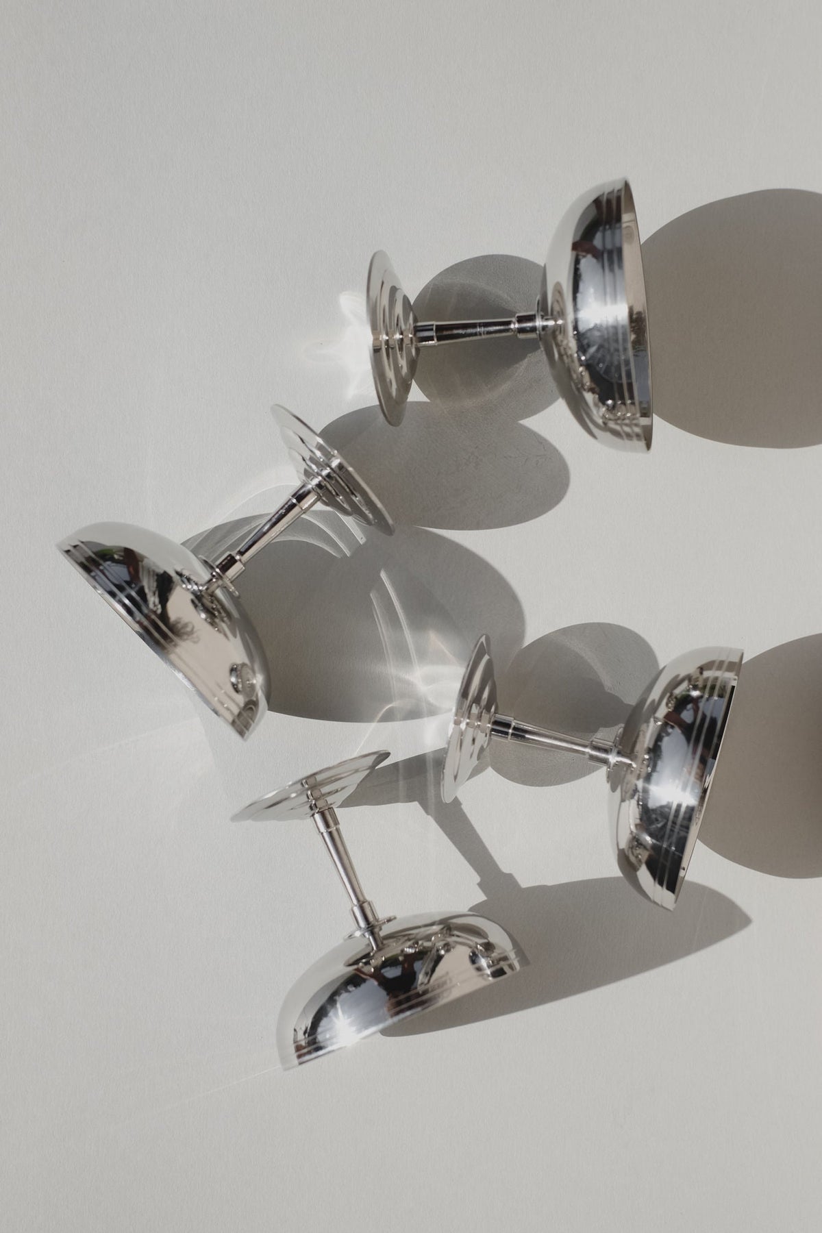 Chrome ice coupes stacked artistically showing reflective surfaces