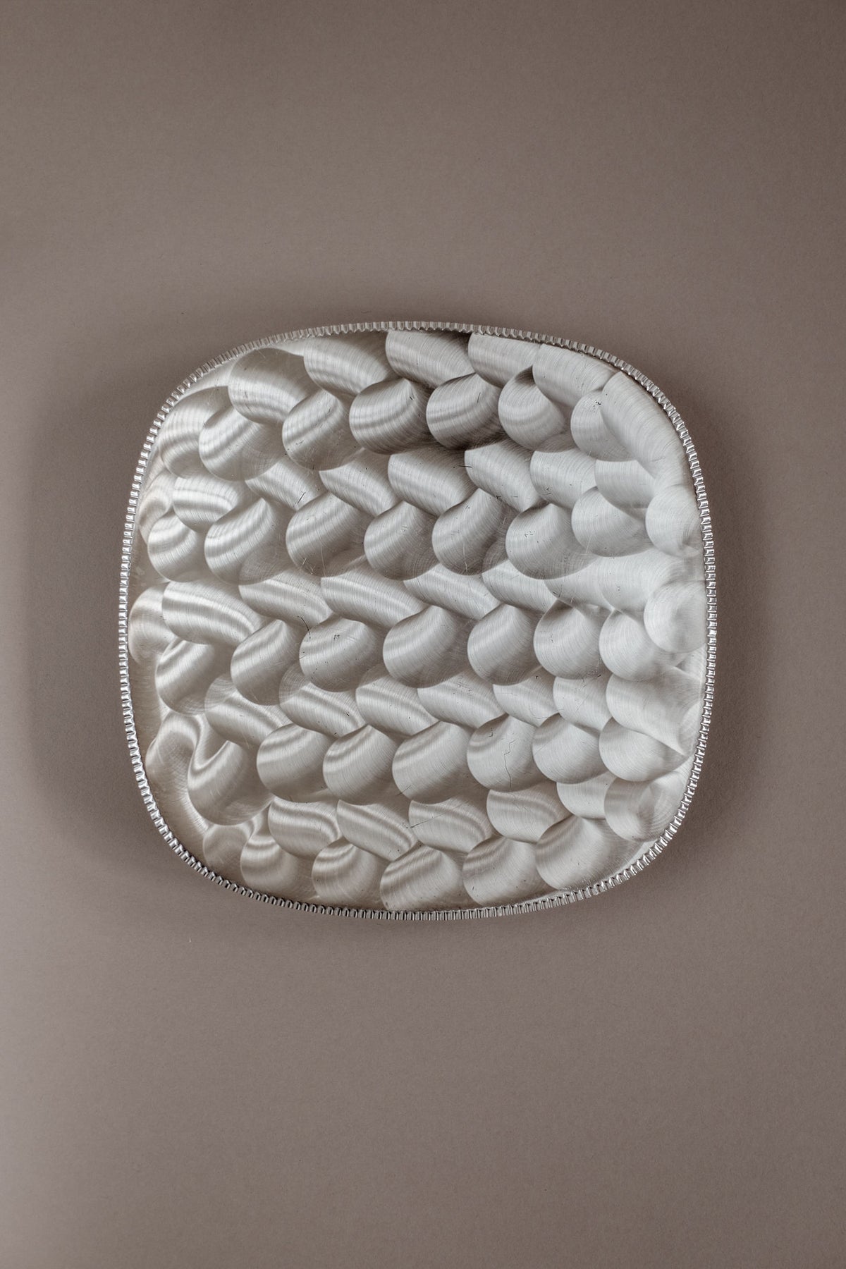 Silver-plated decorative dish with textured petal pattern interior