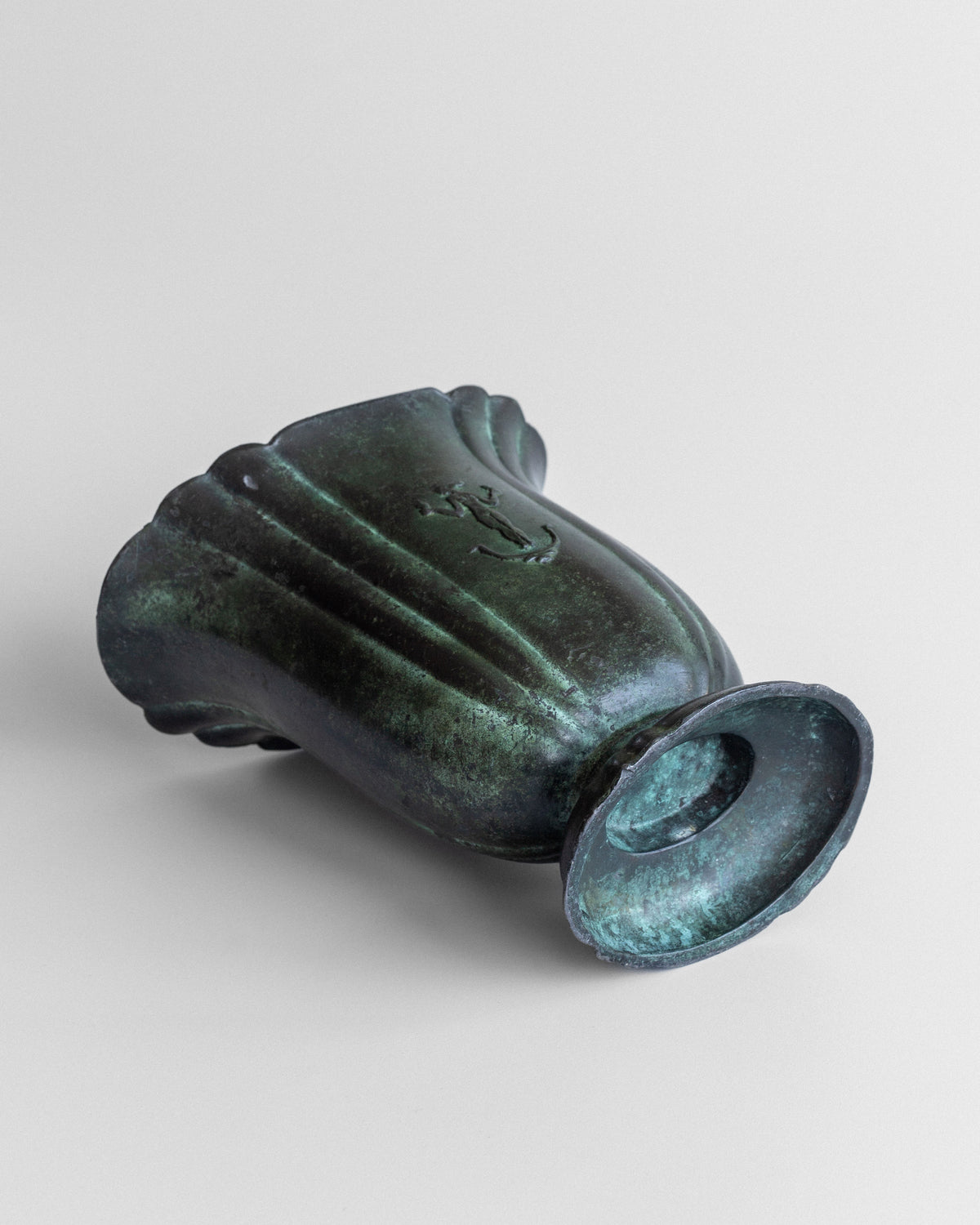 Oxidized green patina detail of Art Deco cast iron vase