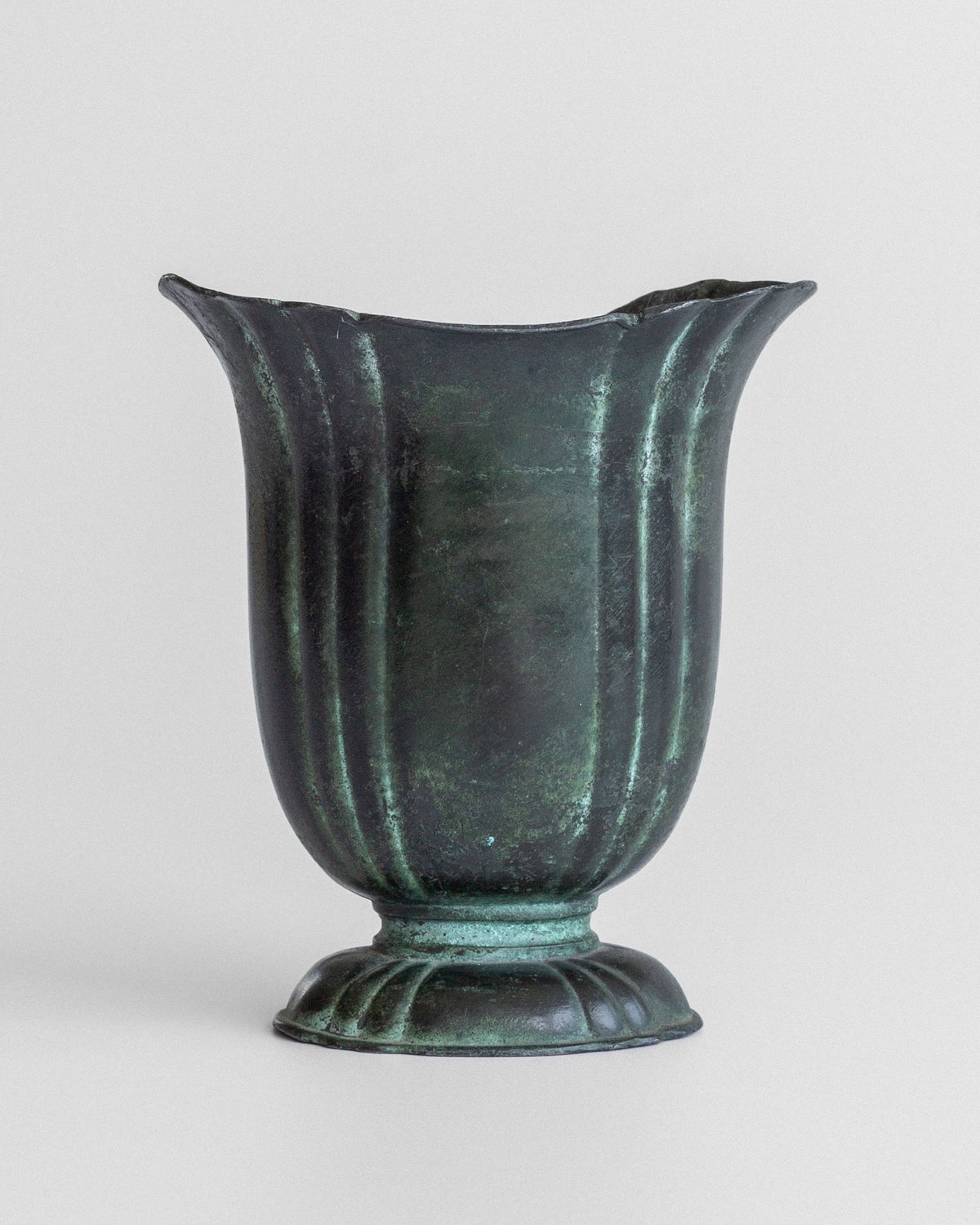 Cast iron Art Deco vase with fluted design and verdigris patina