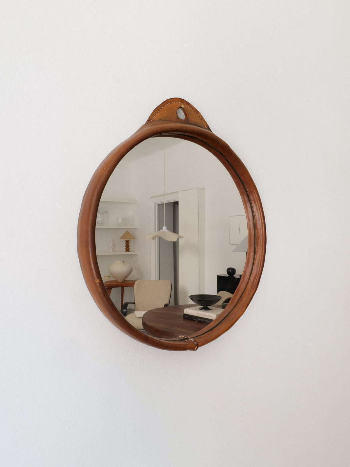 Vintage round saddle leather framed mirror from 1950s