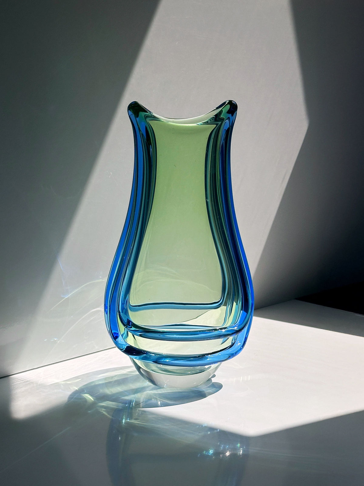 Bohemian glass vase detail showing blue and green layers by Zemek