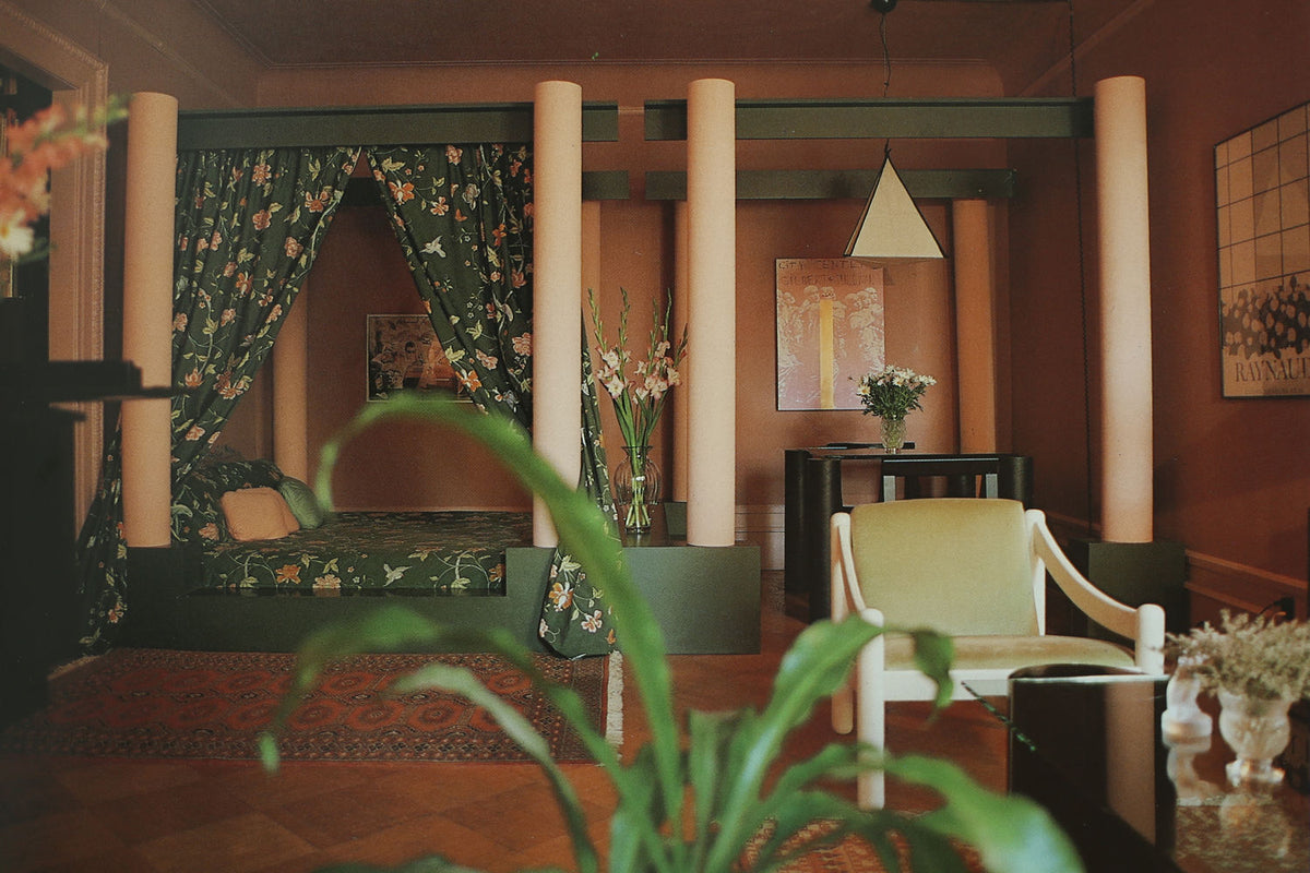 Ornamentalism art book styled in warm-toned interior with floral textiles