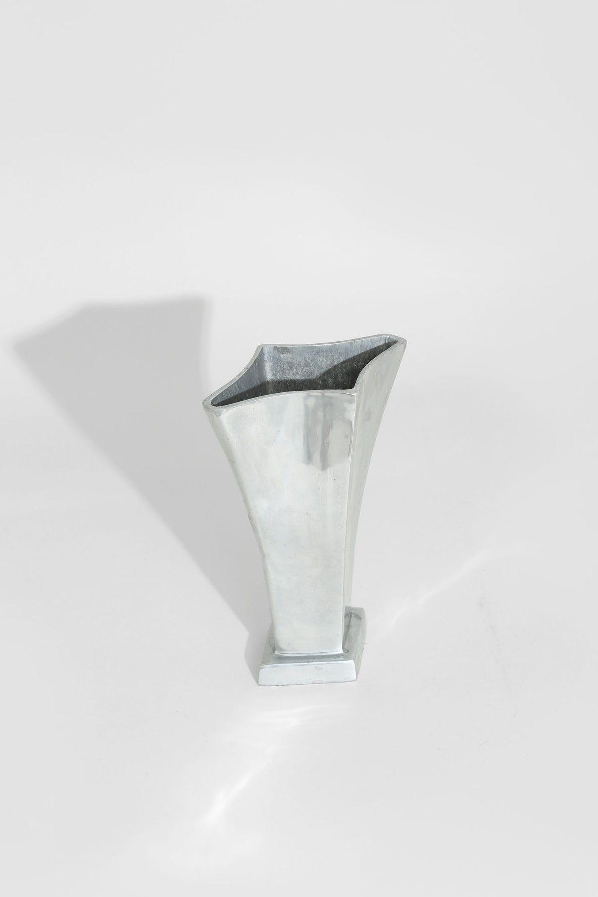 Chrome tulip vase with angular opening, modern minimalist design