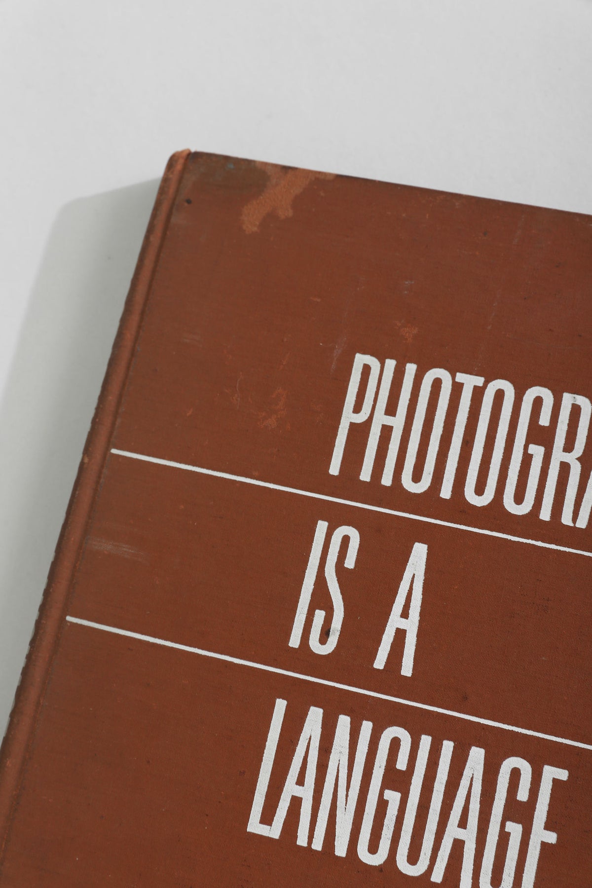 Brown hardcover Photography is a Language book cover detail