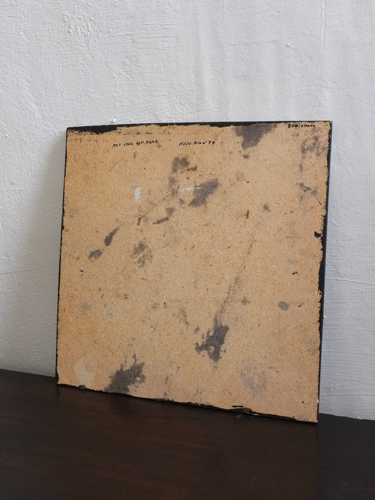 Back view of Swedish ceramic wall sculpture showing mounting hardware and artist signature
