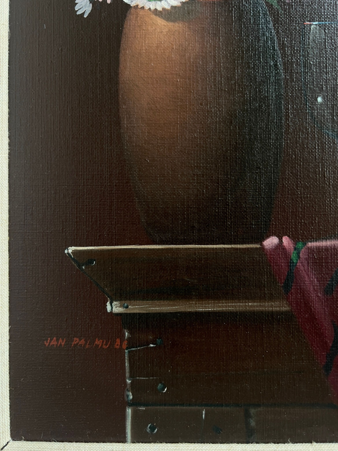 A close-up of Veter Vintage’s "Still Life Painting by Jan Palmu, Finland 1986" shows the bottom of a brown vase on a wooden table with a red-green cloth and the artist’s signature in the lower left corner.