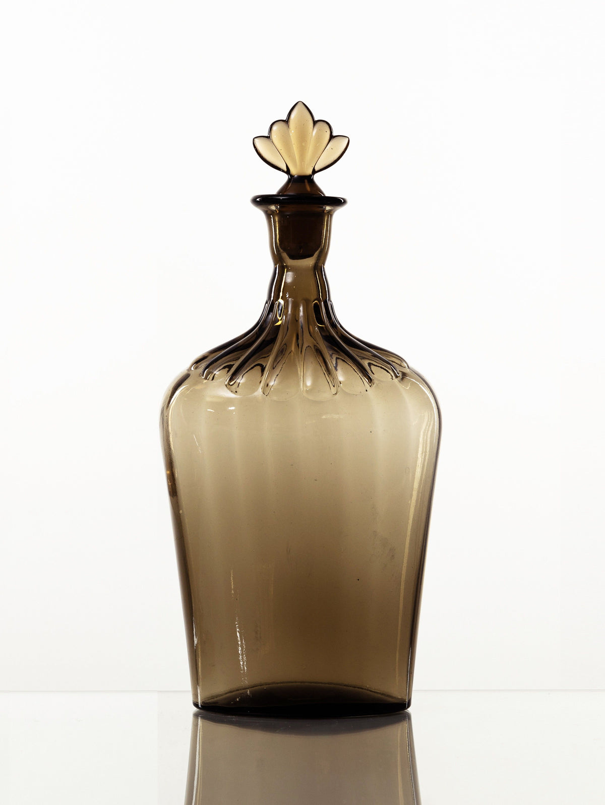 Amber glass decanter with ornate stopper by Simon Gate for Orrefors