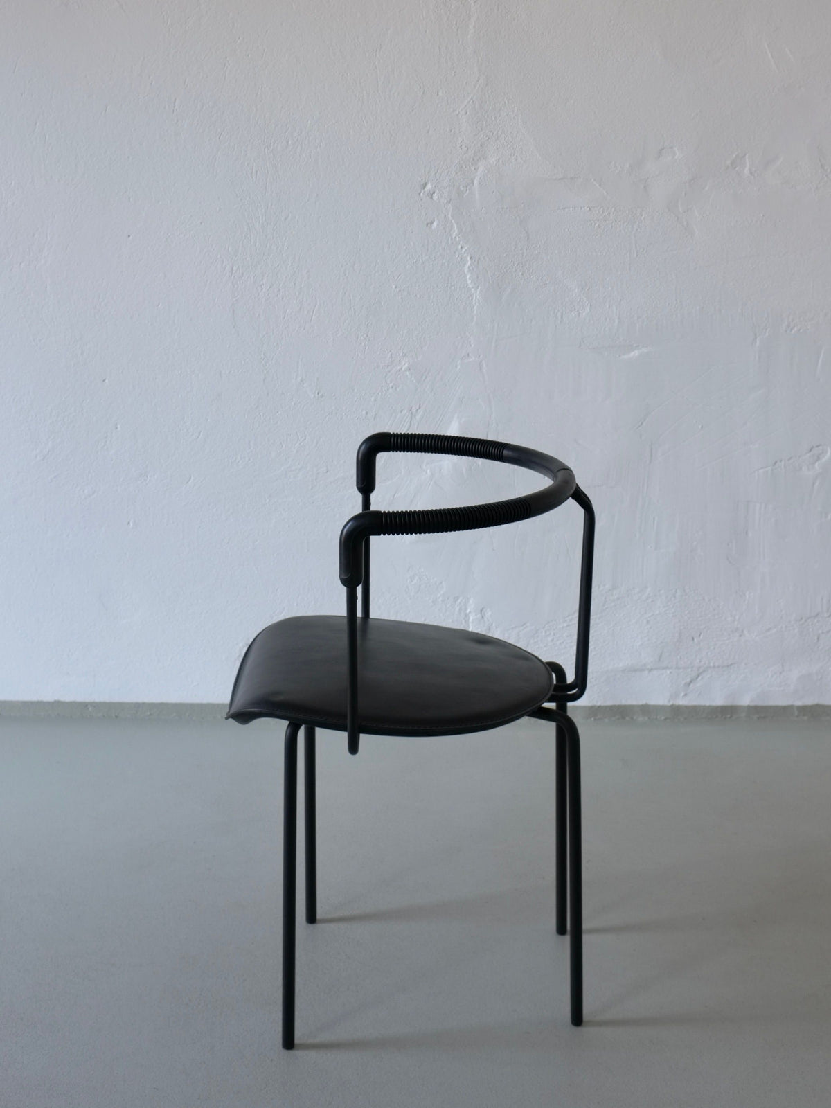 Black leather Cidue postmodern armchair profile view 1990s Italy