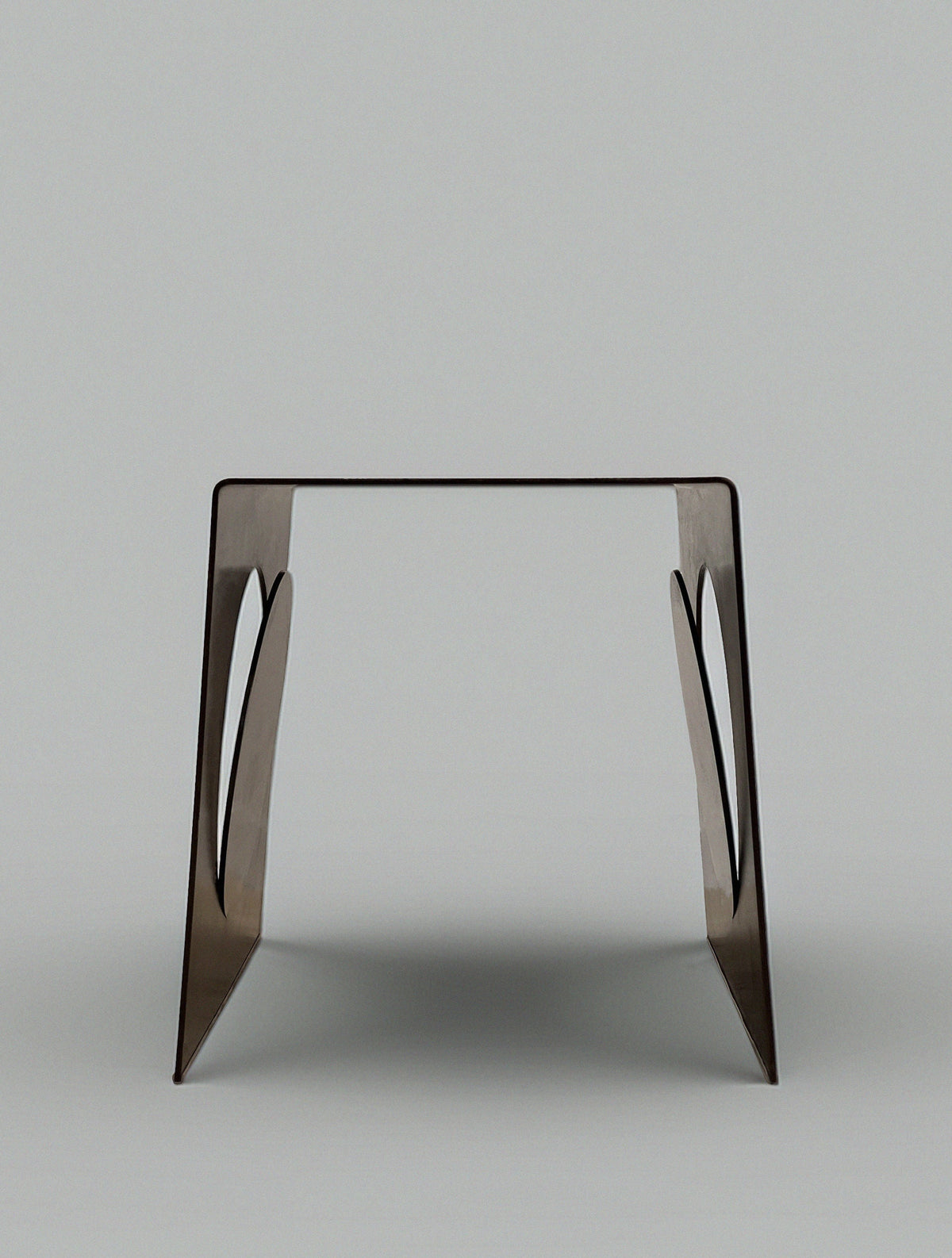 The Modan 'Era' Side Table features a flat rectangular top and two angled steel sheet legs with cutout designs, all in a modern minimalist style, set against a plain light gray background.