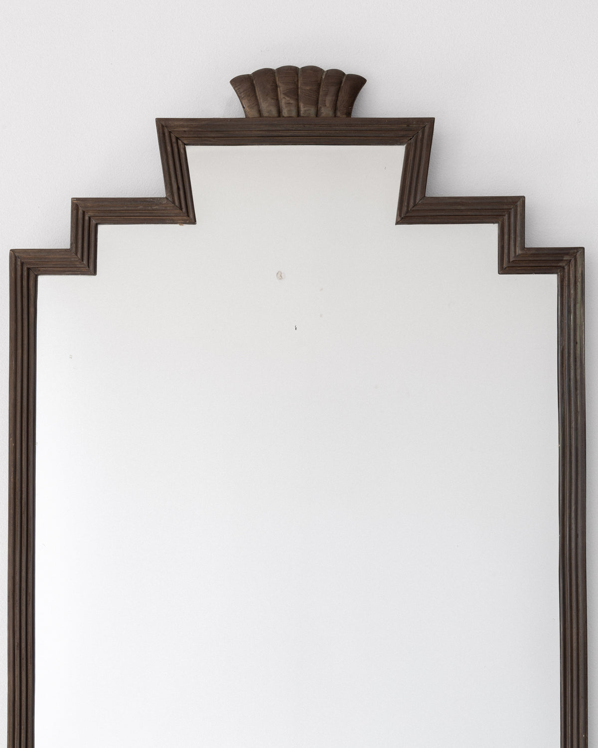 Art Deco bronze mirror frame detail with stepped crown molding