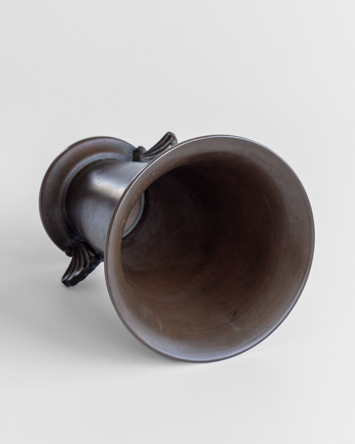 Interior view of Danish Art Deco bronze vase showing smooth curves