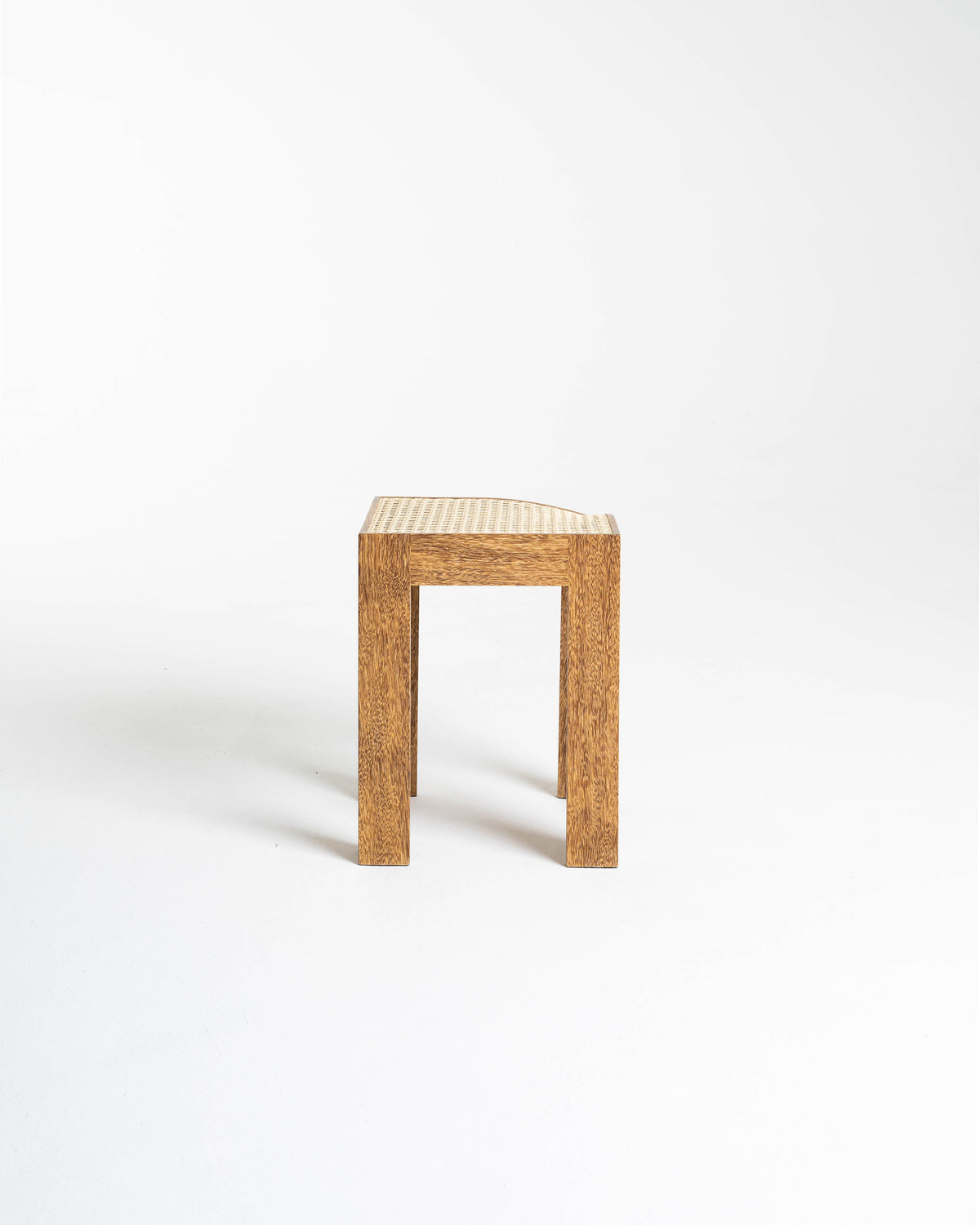 Canto oak stool with woven cane seat by Andre Grippi, side view