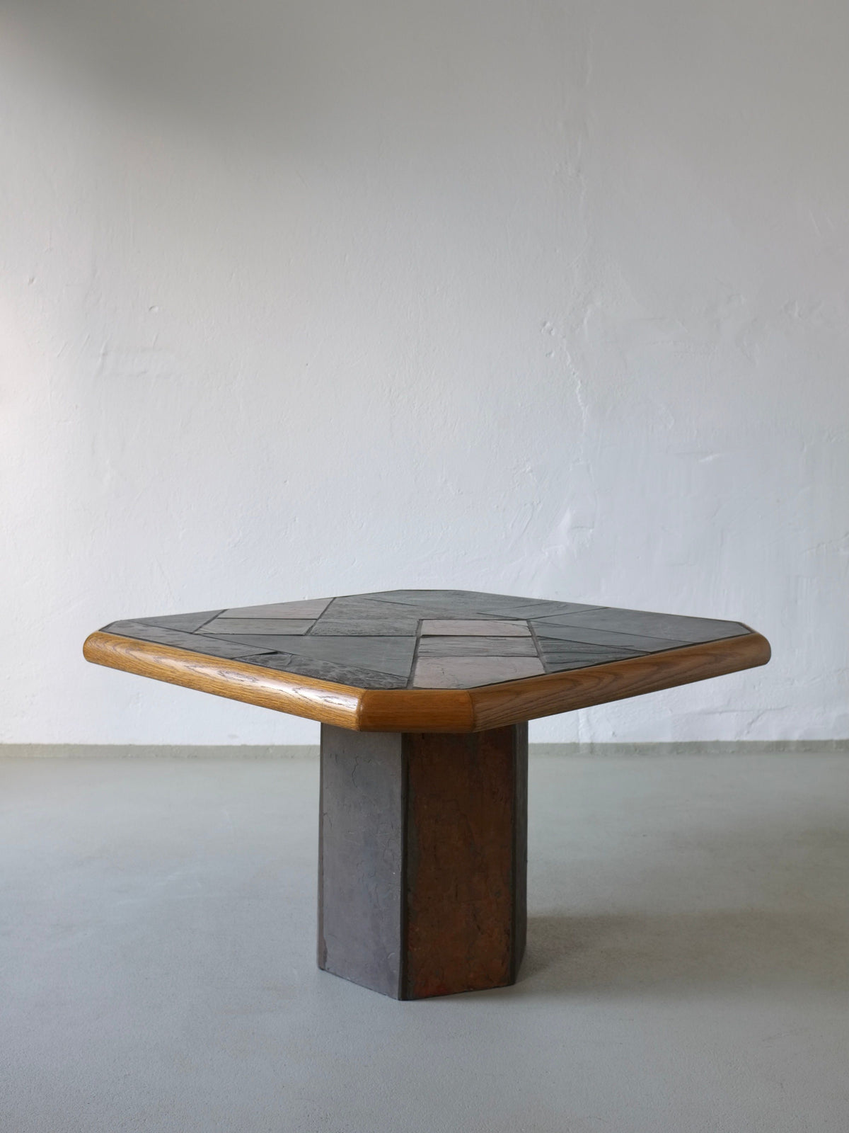 Brutalist stone and oak square coffee table perspective view