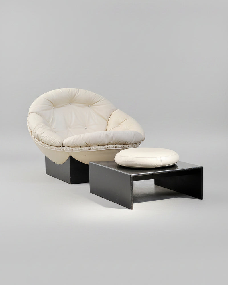 Vintage cream leather Apollo lounge chair with black base and ottoman