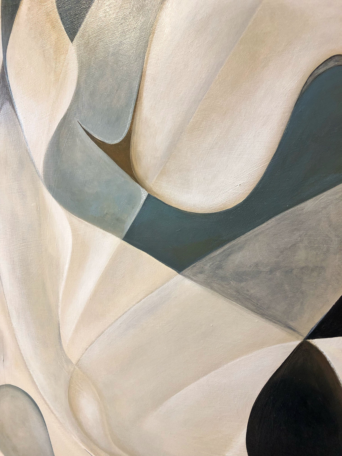 The "Fragments of The Unseen, 2024" painting by Cate Adriana showcases smooth, overlapping shapes in earthy tones of beige, gray, and black on a linen canvas. The curving forms create a sense of movement and depth, while subtle shadows and highlights enhance the three-dimensional effect.