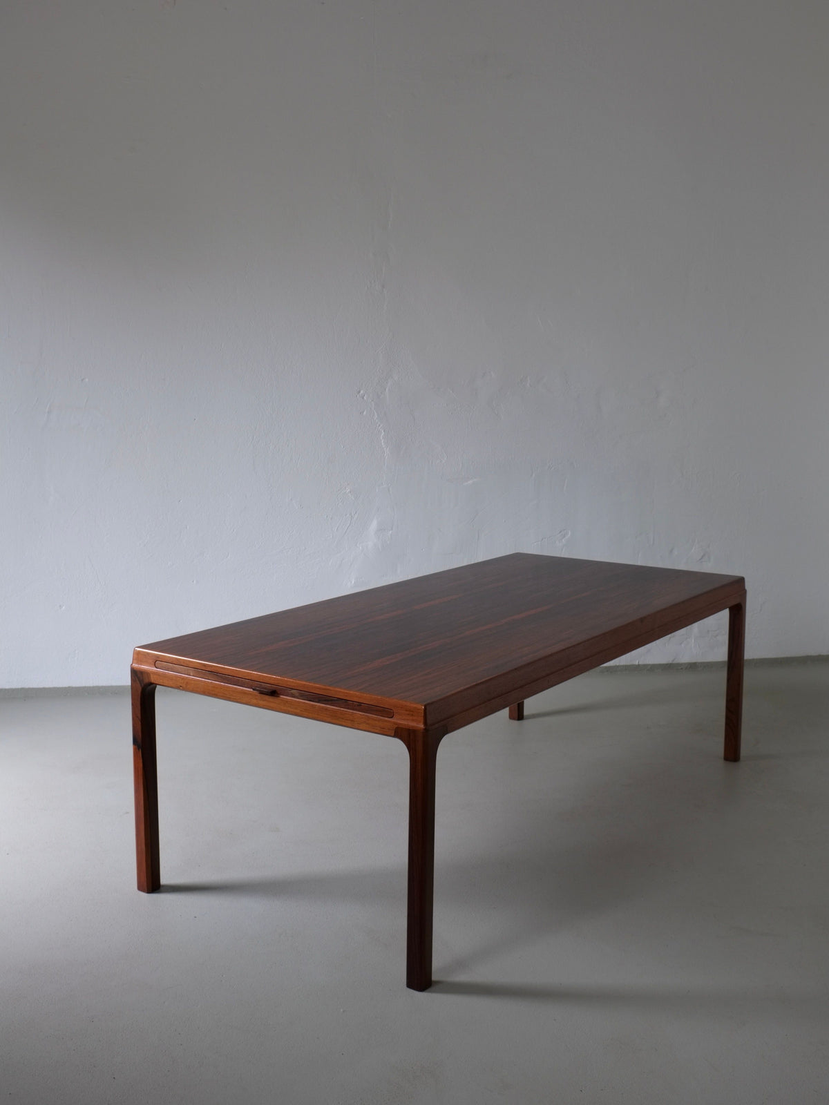 Johannes Andersen rosewood coffee table perspective view 1960s