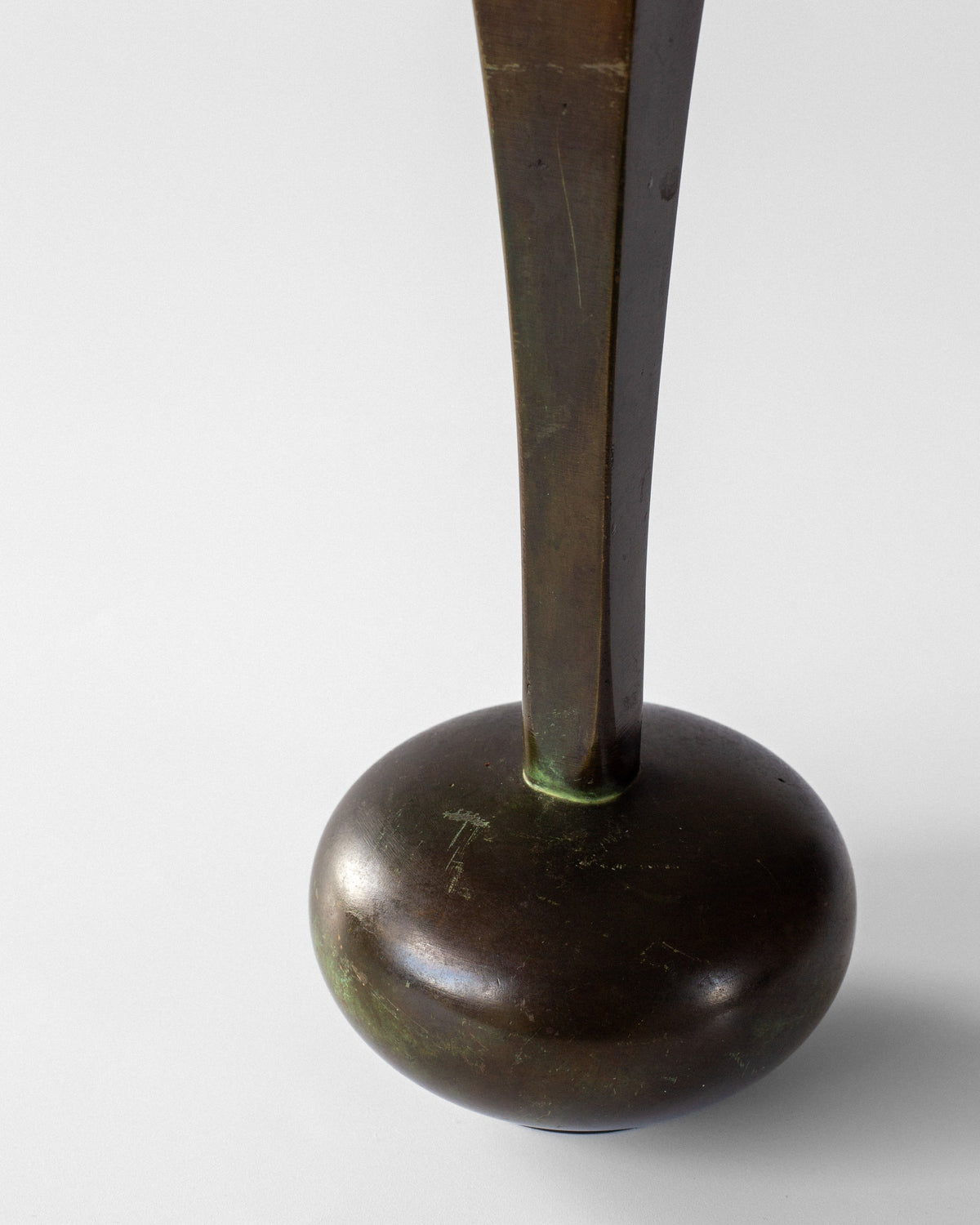 Bronze Art Deco vase base detail showing patina and maker's mark