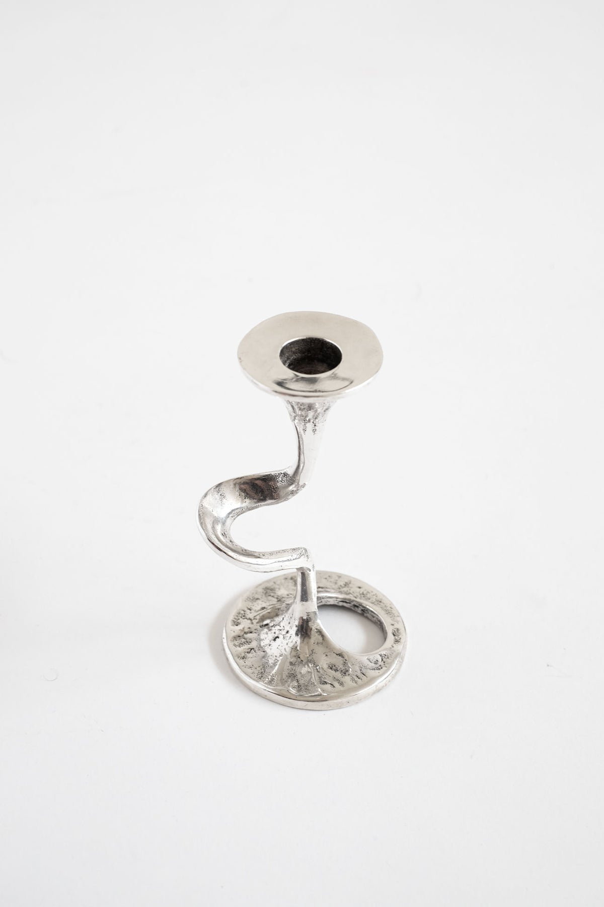 Silver-plated candlestick holder with curved stem and round base
