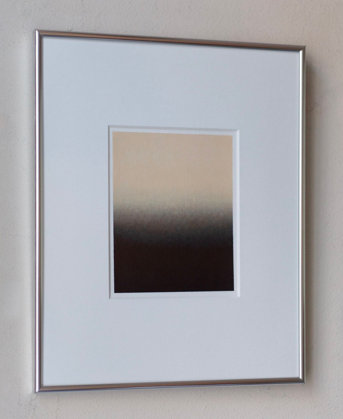 A piece of framed artwork on a wall features "Untitled, 2024" by Rebecca von Matérn, an acrylic painting with a gradient design transitioning from light beige at the top to dark brown at the bottom. The simple frame has a silver aluminium finish, highlighting this abstract piece.