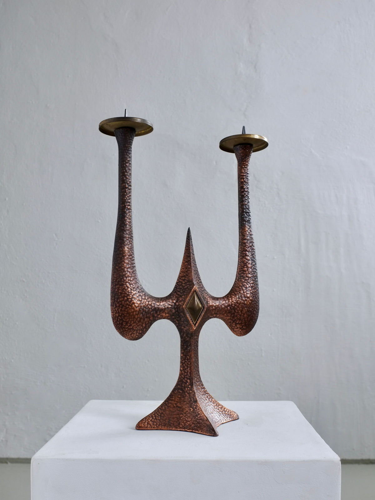 Brutalist copper candle holder with hammered texture and brass accents