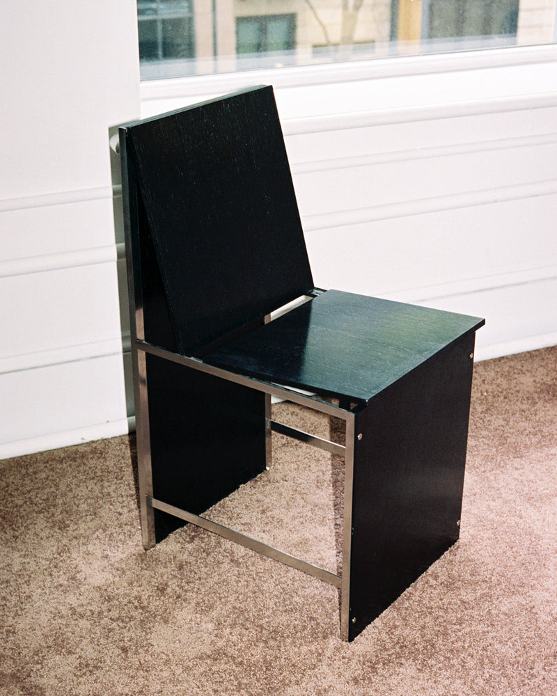 Black Chair 2022 in sleek modern design with comfortable cushioned seat and armrests