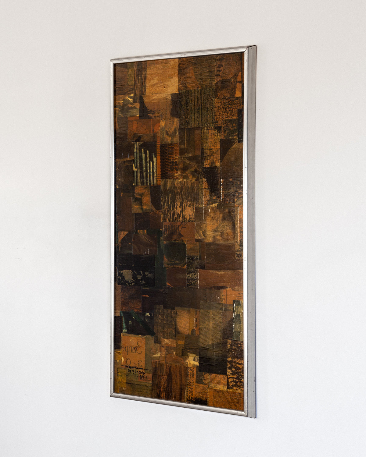 A rectangular framed artwork by Spigel on a white wall showcases the "Mid-Century Abstract Collage Artwork | 1964, Sweden" by Lars Bergander, featuring brown and earth-toned textured papers with wood and fabric patterns in a mid-century modernist style.