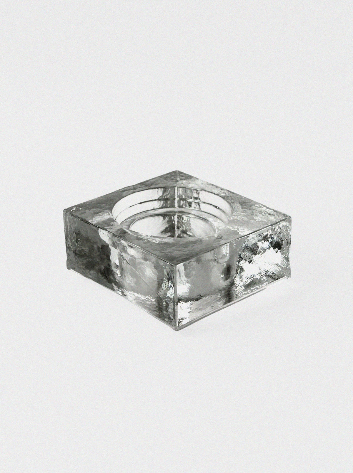 Clear glass ice block ashtray with square form and circular bowl