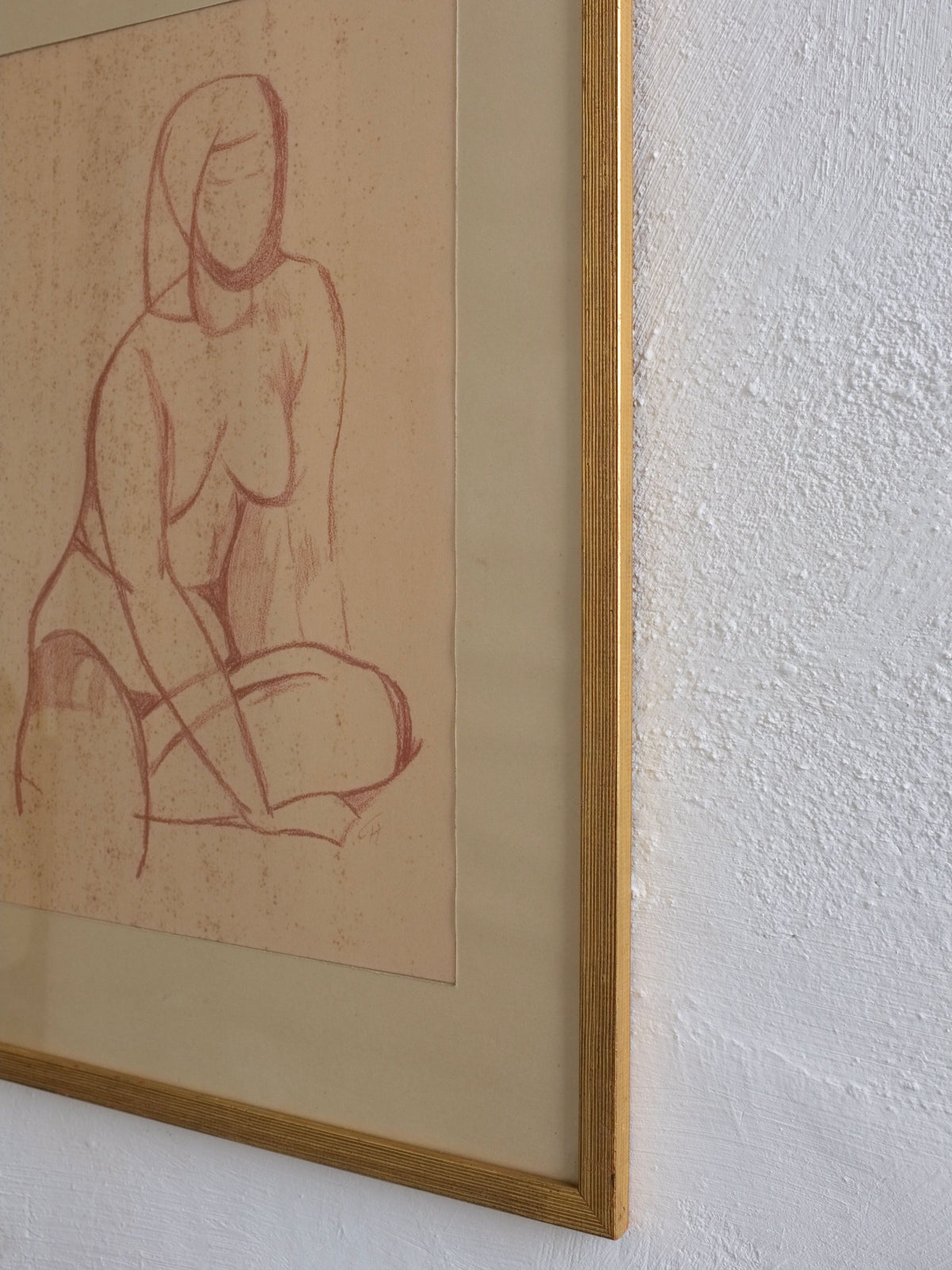 Framed modernist nude drawing showing seated female figure in red chalk