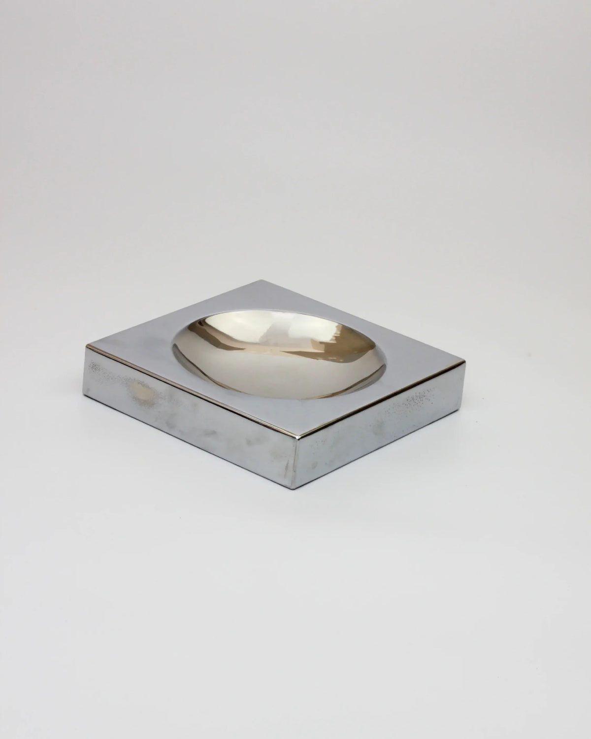 Chrome-plated space age vide-poche with curved bowl detail