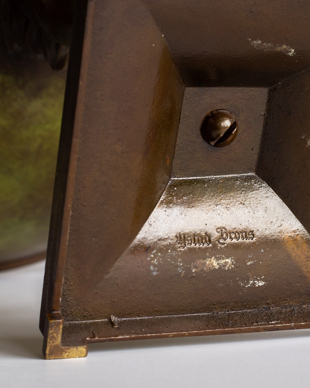 Close-up of engraved maker's mark on Swedish Art Deco bronze bowl base