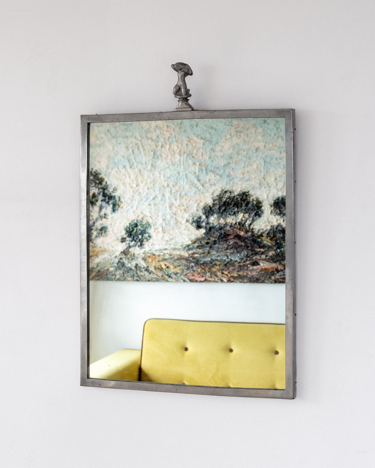 1930s Swedish Art Deco pewter mirror reflecting yellow chair