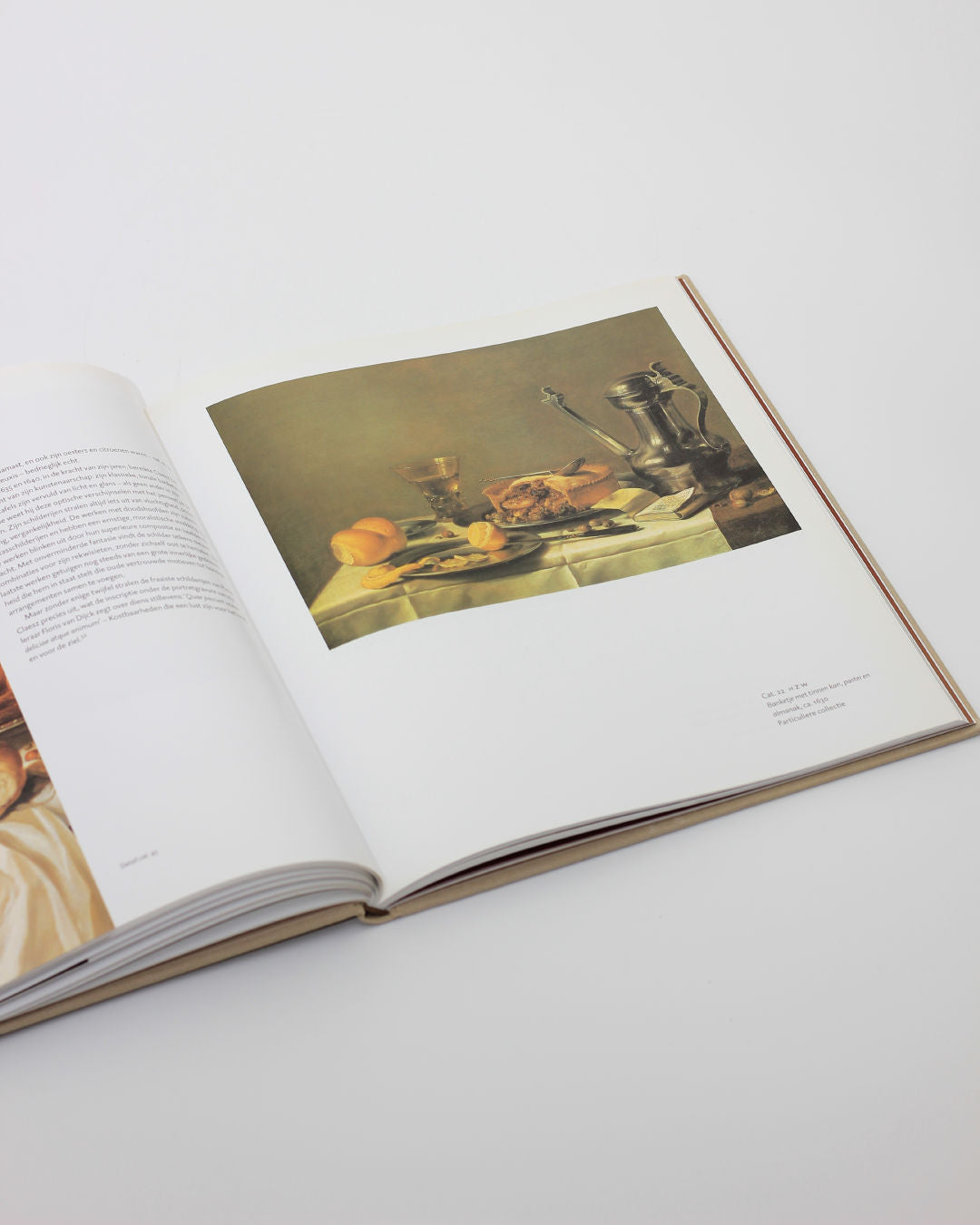 Open Pieter Claesz art book showing Dutch still life painting