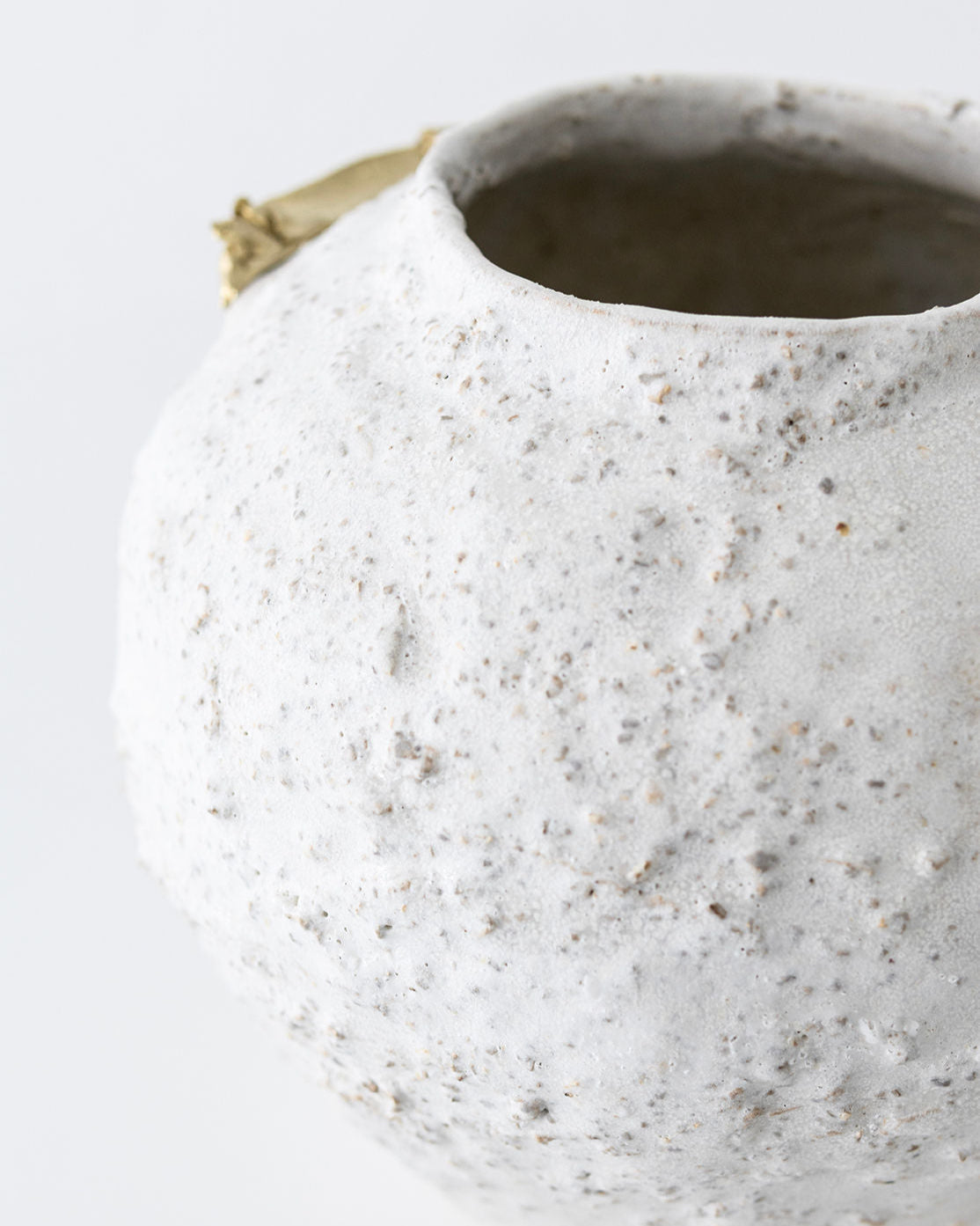 Close-up detail of speckled white ceramic Isolated vase texture