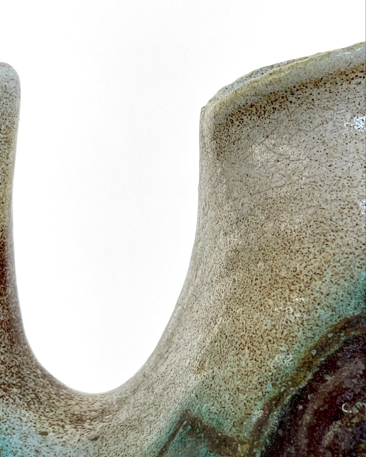 Close-up detail of speckled ceramic Zoomorphic vase texture