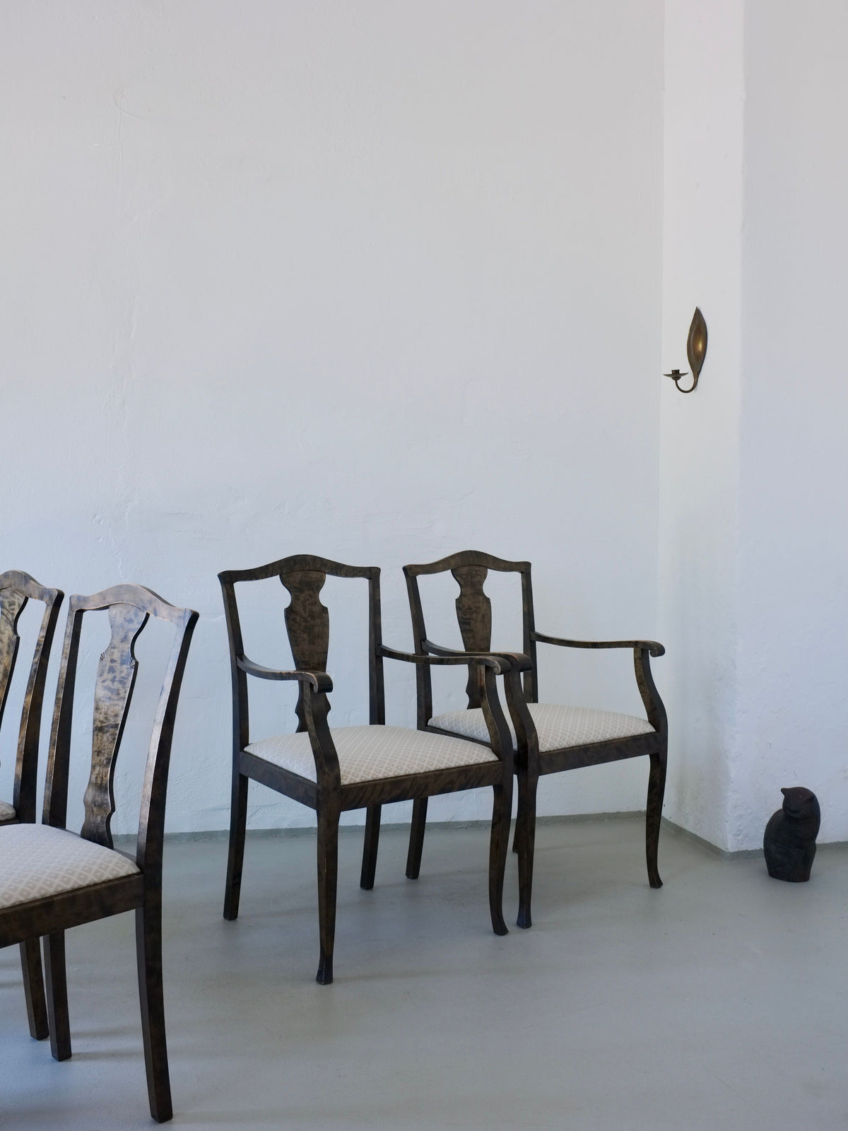 Swedish Grace satin birch dining chairs arranged in minimalist room