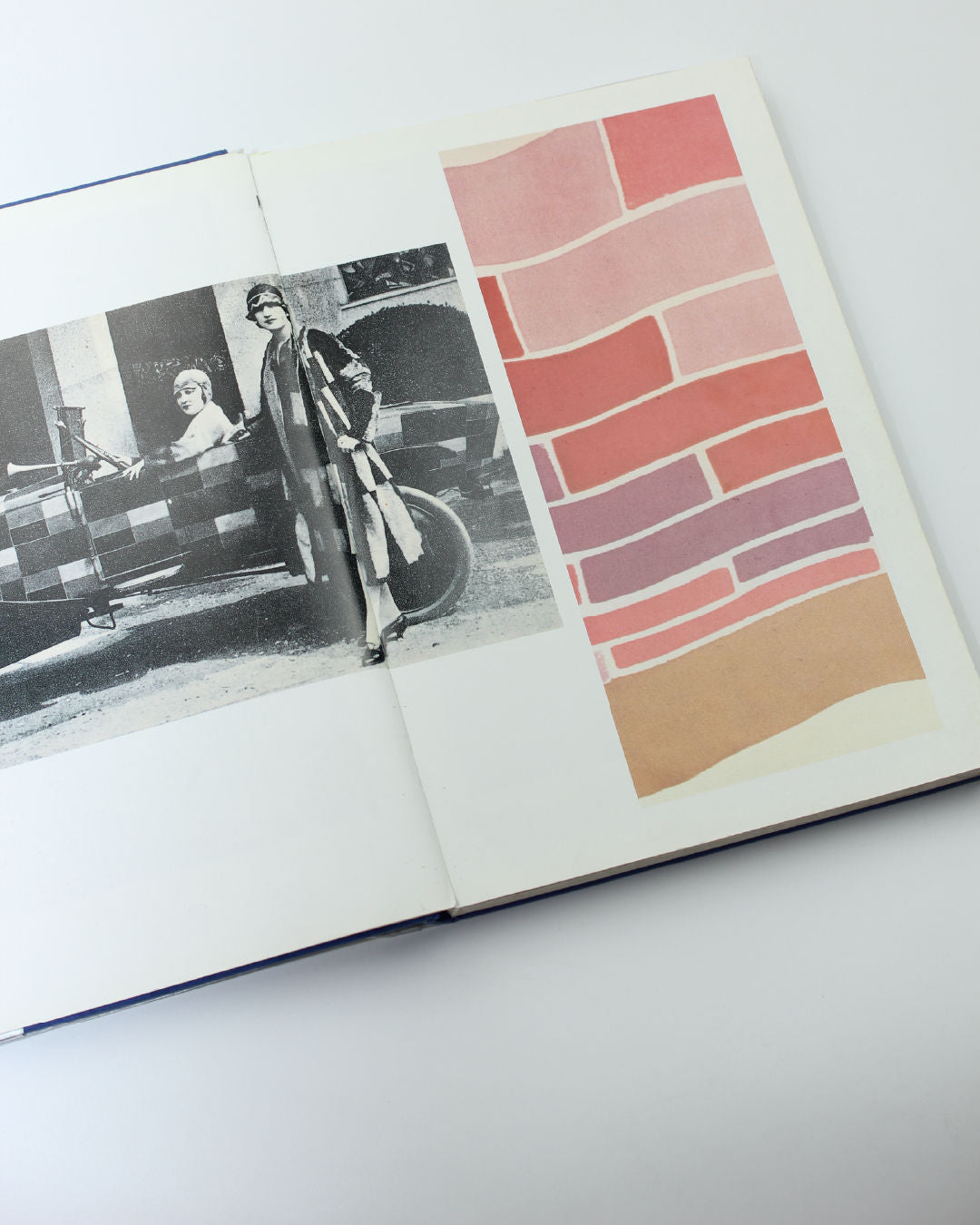 Open Sonia Delaunay book showing vintage fashion photography and fabric color swatches