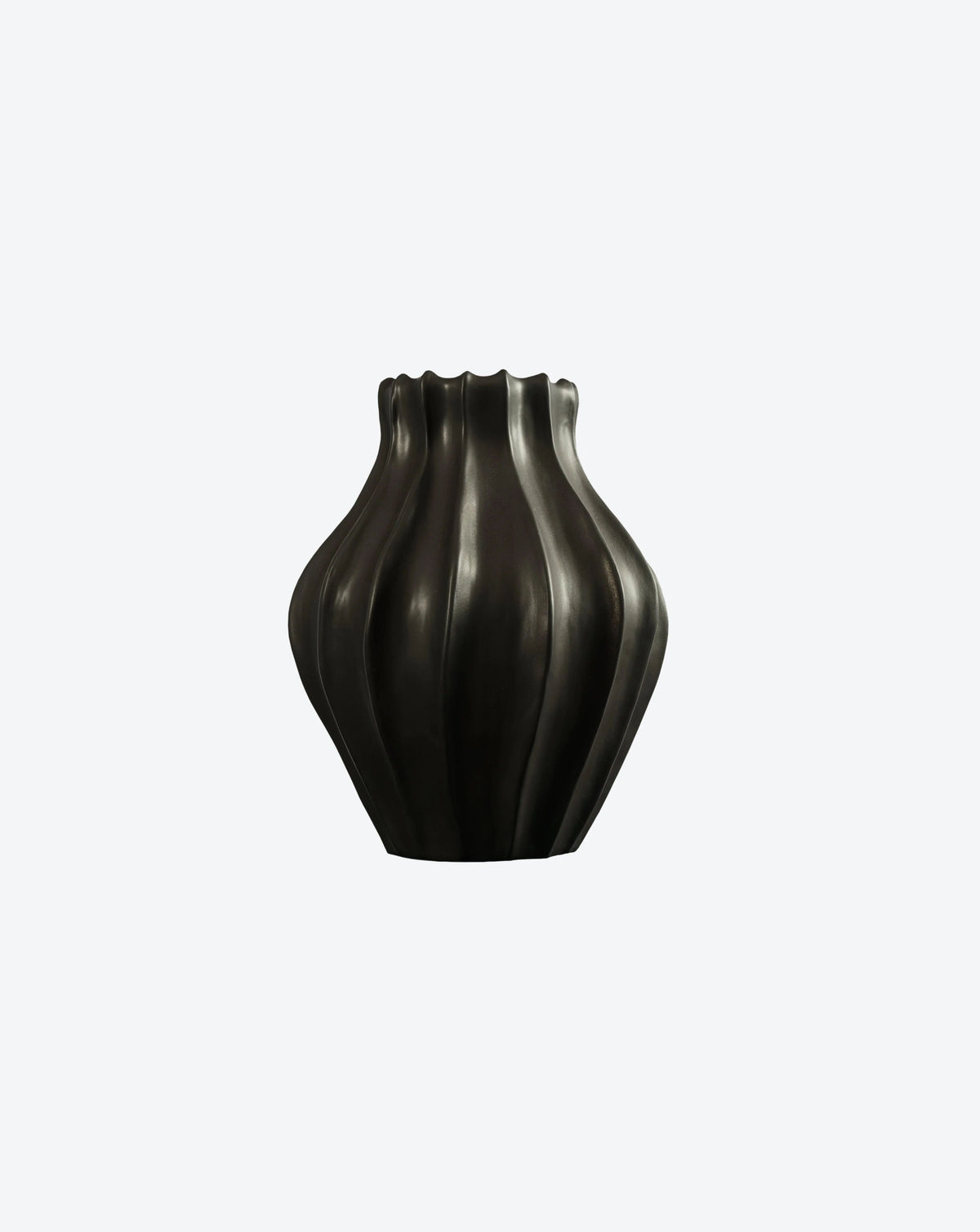 The Medium Cloak Vase by Ransom & Dunn showcases a wavy, black ceramic design with a textured surface and a scalloped rim, set against a plain white background. Handmade in Portugal, its flowing drapery-like pattern or fluted design makes it an eye-catching piece in any ceramic collection.