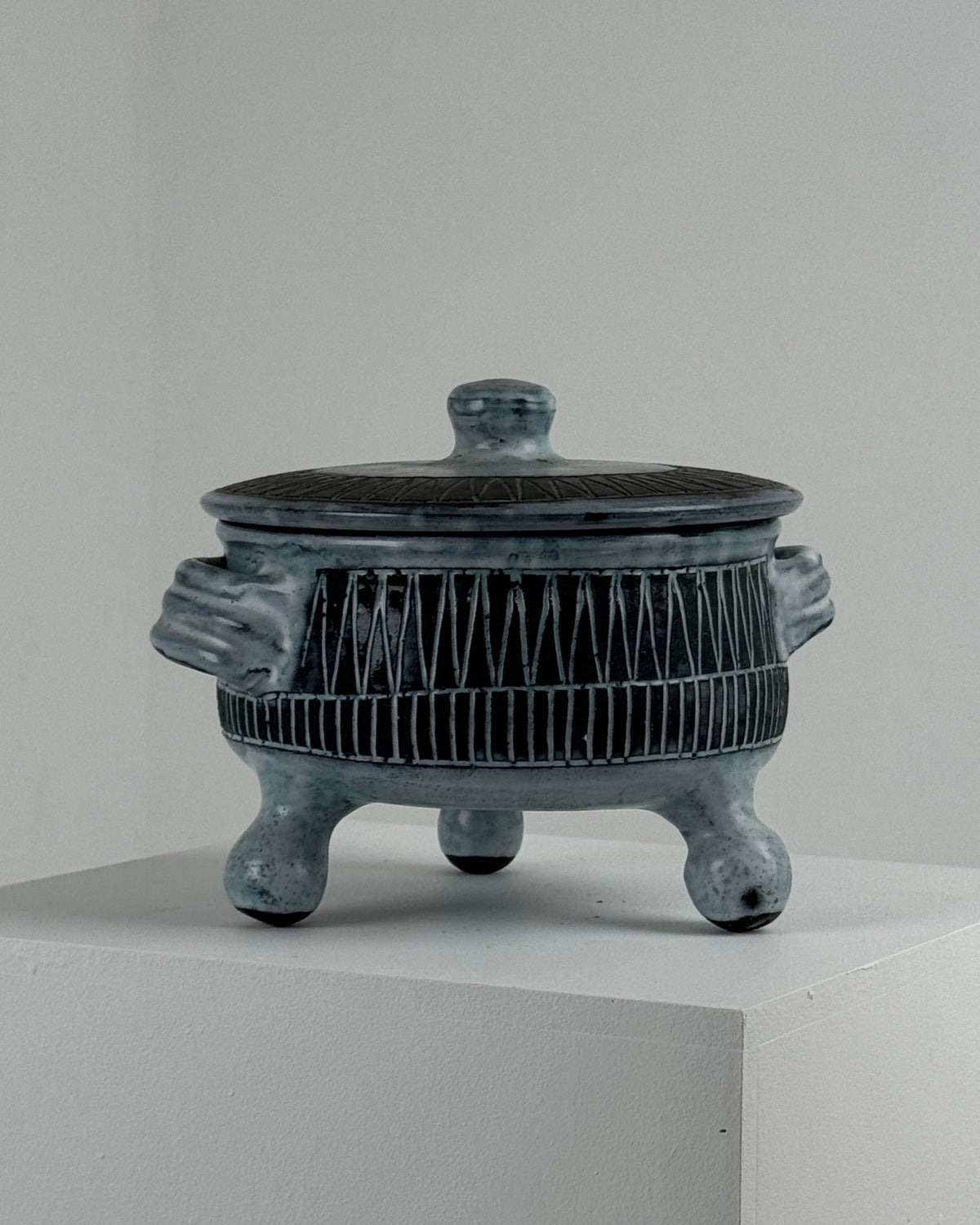 Gray ceramic tureen with geometric patterns and tripod legs by Pouchain