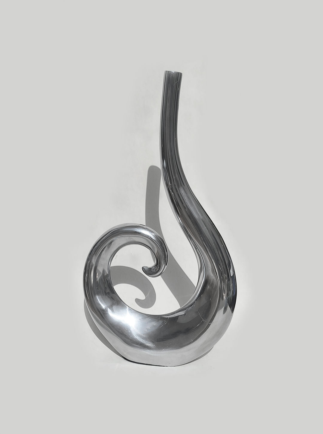 Modern gray glass spiral vase with curved flowing design by Les Objoies